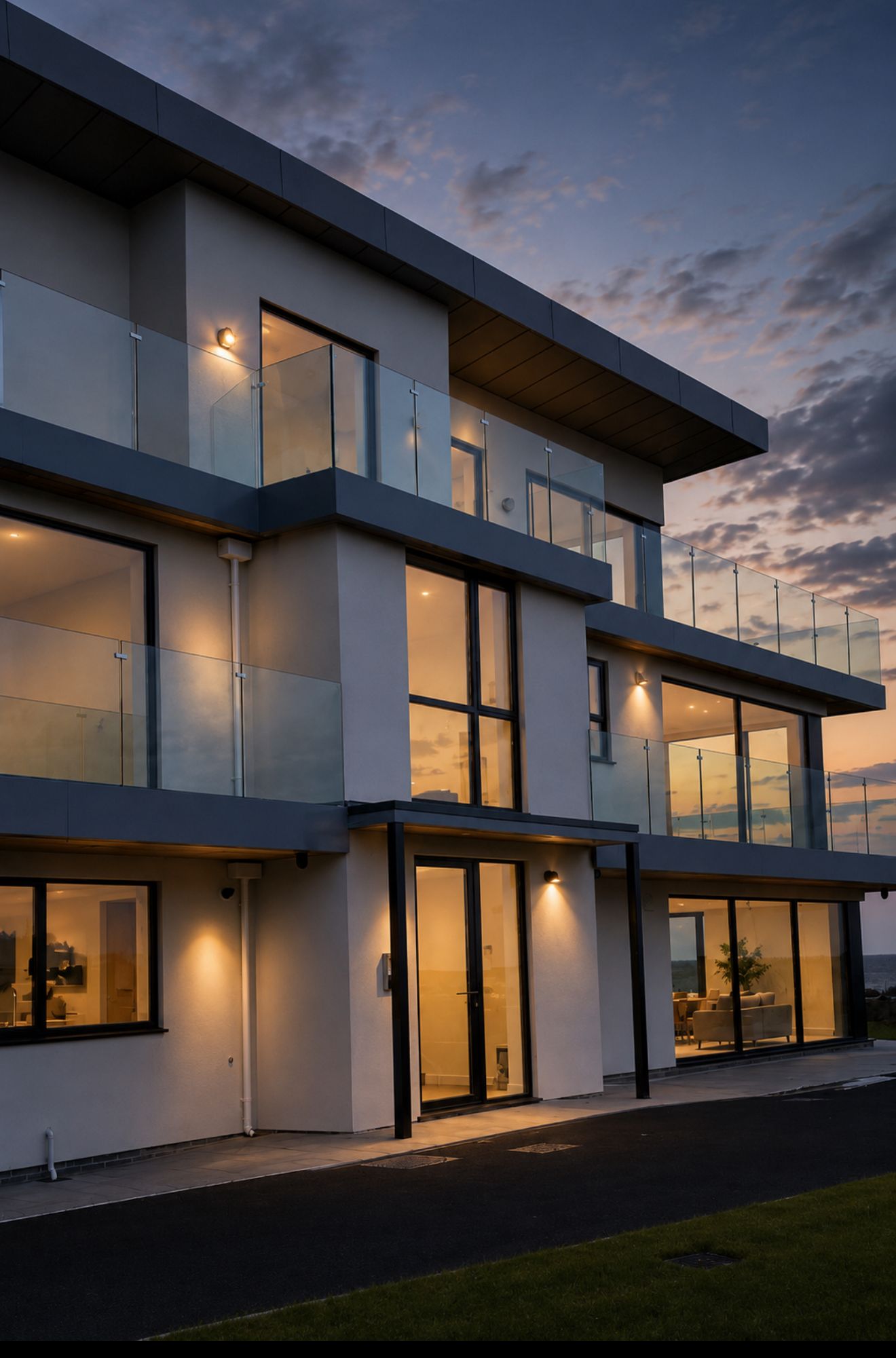 Modern multi-storey residential building with premium glass and steel balustrade installation