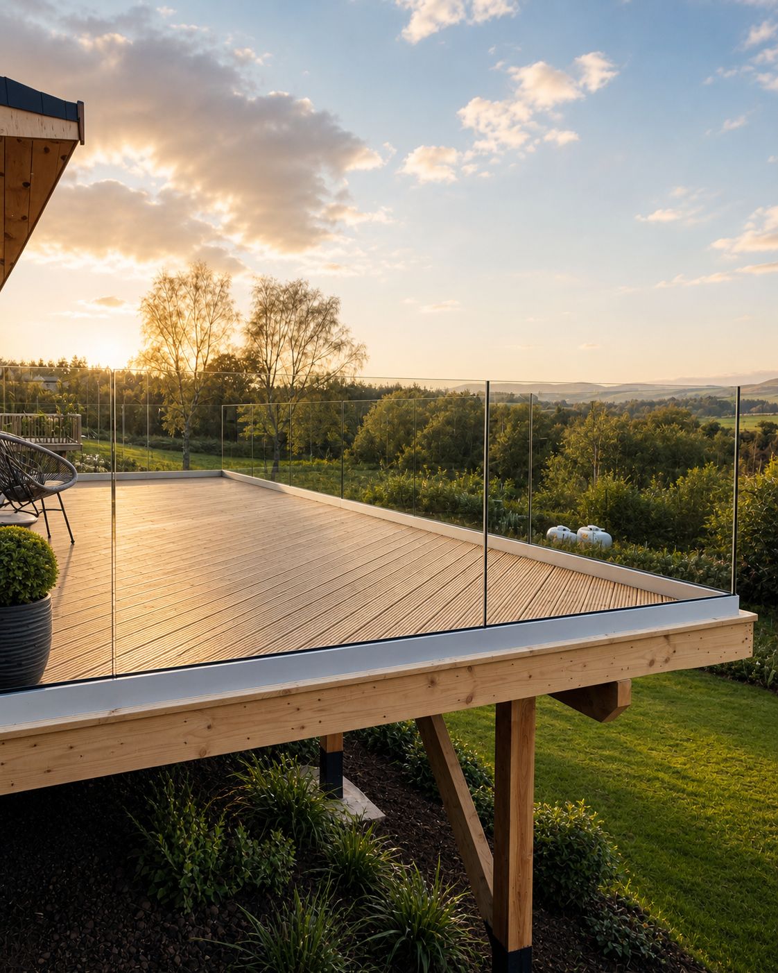 Frameless glass balustrade panels on a modern residential terrace with unobstructed outdoor views